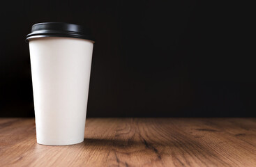 white coffee cup on dark wooden background