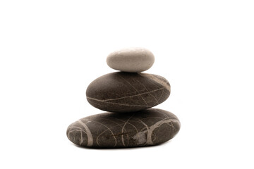 A stack of stones on a white isolated background .Balance and harmony. Copy space.Horizontal photo. Spa and healthcare concept.