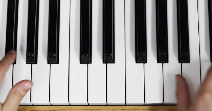 young pianist playing piano waltz with two hands, Flatlay