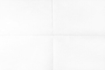 White crumpled unfolded paper sheet texture background. Paper folded in four. Full frame