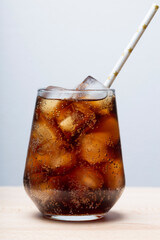 rum with cola and ice in a glass close-up, cola with ice. summer drink