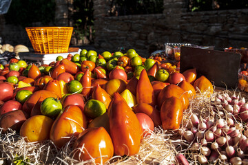 Fresh tomatoes on a market counter. Colorful regional vegetables for healthy nutrion.