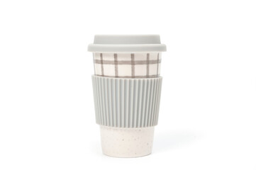 Checkered ceramic cup with rubber lid, shot against a white background.