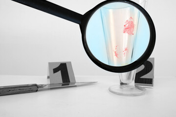 evidence idfresh splatter of red blood on glass goblet, forensic specialist identifies fingerprints...