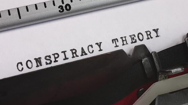 Typing a Conspiracy Theory on an old manual typewriter. A plot or plan to carry out something harmful or unlawful.