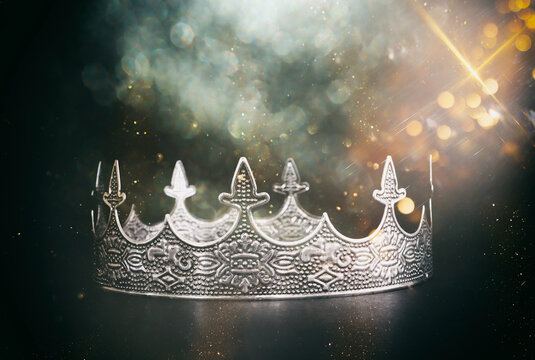 low key image of beautiful queen or king crown over dark background. fantasy medieval period