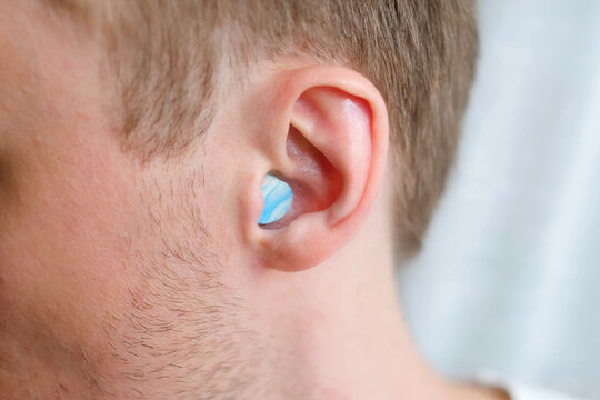 Soft earplug in human ear. Noise protection