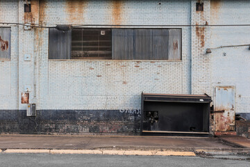 Decaying brick wall of industrial building