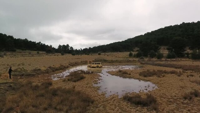 Classic Offroad Car Crossing Puddle
