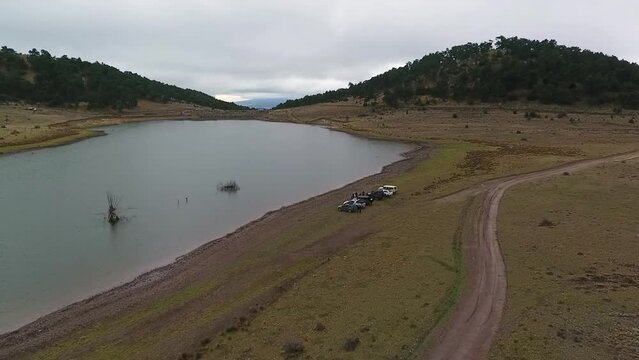 Offroad Group Resting Near a Lake