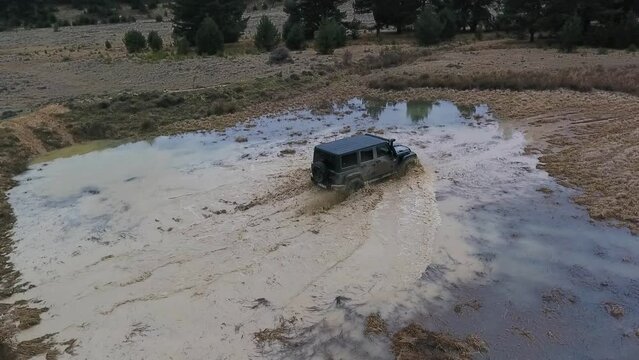 Offroad Car Crossing Water Puddle Slow Motion