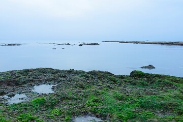 A small fishing boat on the beach in Jaffa, on a foggy day. Concept for peace, quiet and serenity. High key photography. High quality photo