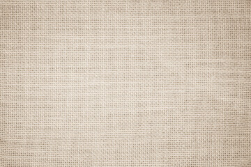 Jute hessian sackcloth burlap canvas woven texture background pattern in light beige cream brown color blank decoration.