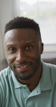 Vertical video of portrait of happy african american man