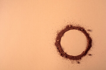 Coffee beans and coffee powder with round copy space.