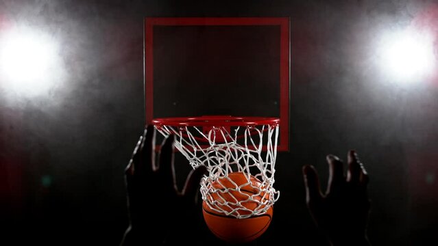 Super slow motion of basketball player hitting the basket. Filmed on high speed cinema camera Phantom, 1000fps. Speed ramp effect.