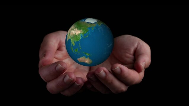 video hands holding world ball on black background. Elements of this image furnished by NASA