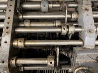 Mechanics of an old machine. Elements old knitting machine. Transmission. Complex mechanics. Parts machine for textile manufacture.