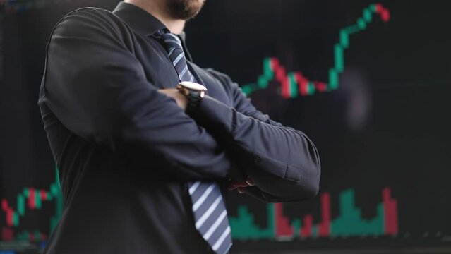 Headless stonks man crossing arms in front of stock trading graph 4K