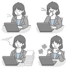 パソコン作業が辛いスーツの若い女性