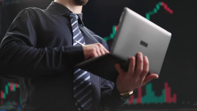 Headless stock finance businessman working on laptop computer 4K