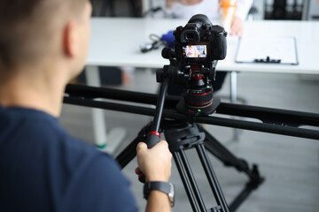 Videographer is filming doctor in clinic closeup