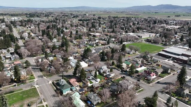 Cinematic 4K aerial drone dolly out footage of the city of Ellensburg, Kittitas County in Western Washington