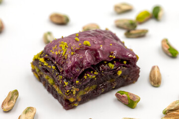 Pistachio purple baklava on a white background. Baklava specially prepared for diabetics. Traditional Mediterranean cuisine delicacies. close up