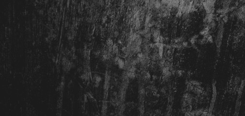 Wall full of scratches. Grungy cement texture for background, Scary dark wall.Black wall