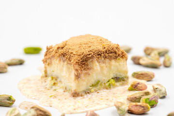Cold baklava on a white background. Cold baklava prepared with milk and pistachio is very popular. Traditional Mediterranean cuisine delicacies. close-up cold baklava. local name soguk baklava