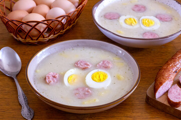 White borscht with sausage and egg. Traditional Polish dish for Easter