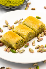 Baklava with pistachio on a white background. Traditional Mediterranean cuisine delicacies. close-up baklava