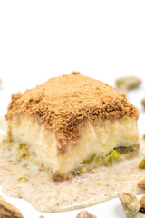 Cold baklava on a white background. Cold baklava prepared with milk and pistachio is very popular. Traditional Mediterranean cuisine delicacies. close-up cold baklava. local name soguk baklava