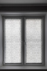 window closed role shutters with mandala pattern