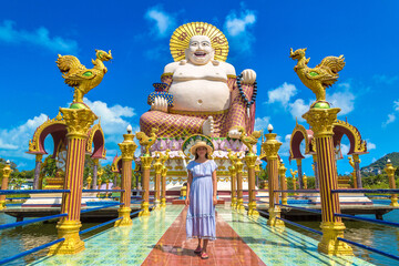 Woman at Giant happy buddha Samui