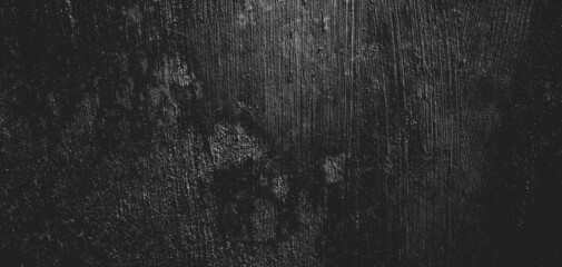 Wall full of scratches. Grungy cement texture for background, Scary dark wall.Black wall