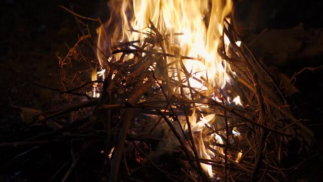 Slow motion shot of fire of bonfire at the night. Bonfire during the winter night to keep people warm at Manali in Himachal Pradesh, India. Bonfire made during the winter season to keep warm.	