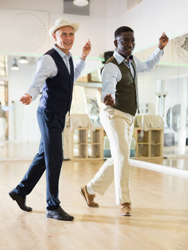 Two men dancing jazz in studio