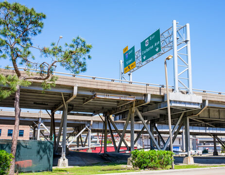 NEW ORLEANS, LA, USA - APRIL 3, 2022: Elevated highway over Claiborne Avenue with road signs for Claiborne Avenue and Slidell Exits in New Orleans, LA, USA