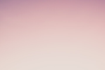 Abstract gradient sunrise in the sky with blue smooth blurred purple and orange natural background.