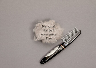 Grooming comb with metal teeth and a large ball of long hair on a gray background. Concept for...