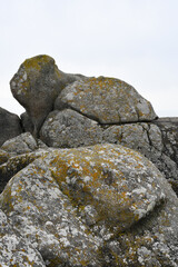 A lichen covered granite boulder on the beach at St Mary's The Isles of Scilly Cornwall