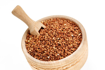 Buckwheat groats in bowls and bags isolated on a white background. High quality photo