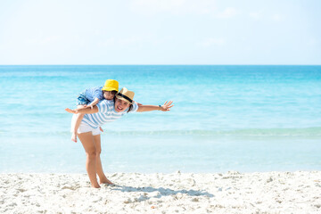 Asia happy family have fun fly on the beach for leisure and destination.  Family people father and girl tourism travel enjoy in summer and holiday, copy space and banner. Travel and Family Concept