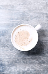 Coffee with milk on wooden background. Top view. Close up. Copy space. 