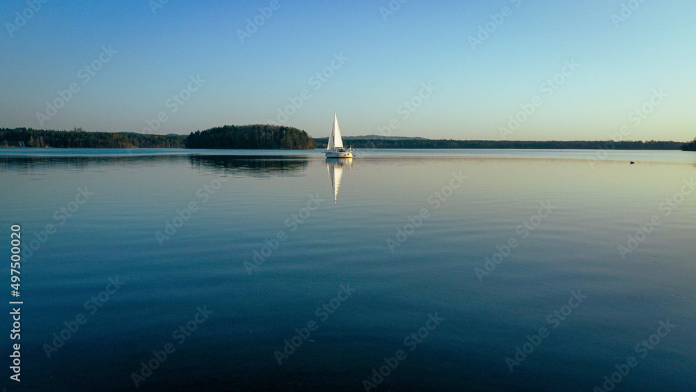 Canvas Prints sailing boat on the smooth water surface against the blue sky. steinberger see, germany.