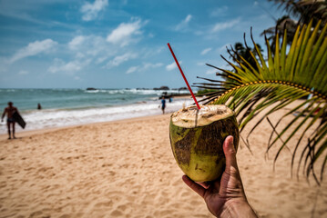 drinking coconut in the hand