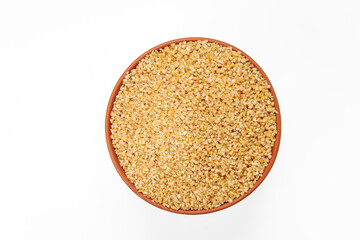 Wheat groats in bowls and bags isolated on a white background. High quality photo