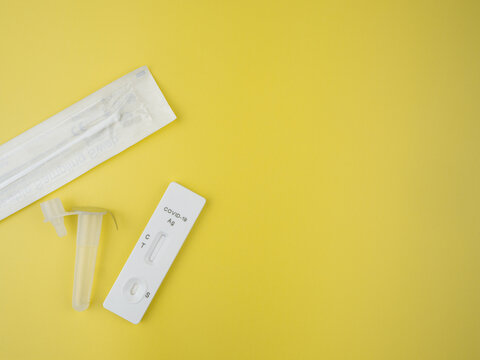 antigen test kit (ATK) for self-testing on isolated yellow background. Covid-19 antigen test kit. Copy space blank area for text.