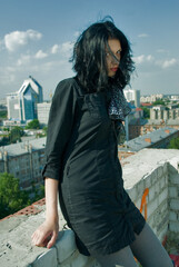 Fototapeta premium Young cool woman relaxes on roof